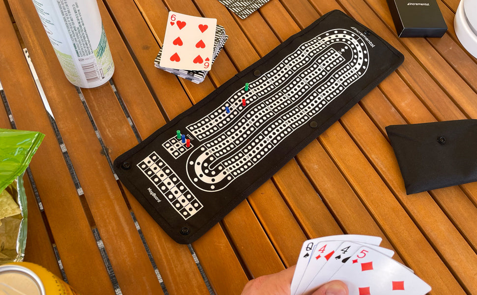 Incremental MagBoard Cribbage open on table with cards and snacks showing